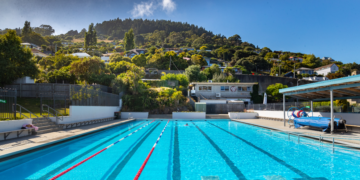 The Norman Kirk summer pool overlooking the Lyttleton Port Hills.  